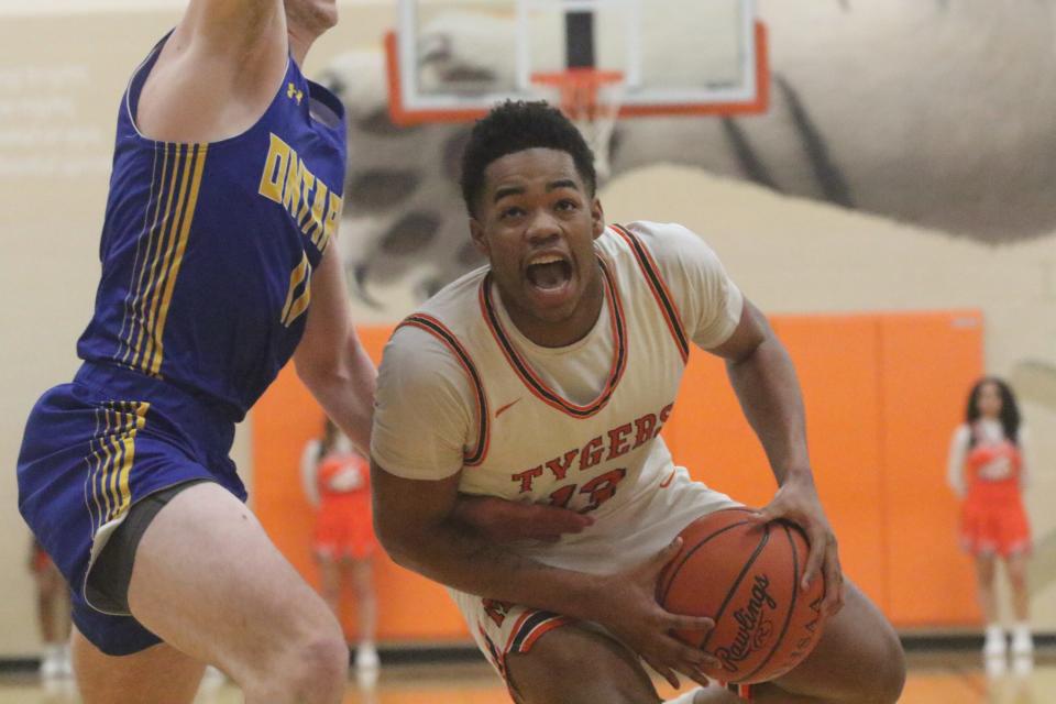 Mansfield Senior's Kyevi Roane drives to the hoop for two of his game-high 24 points in the Tygers' 81-46 win over Ontario Tuesday night.