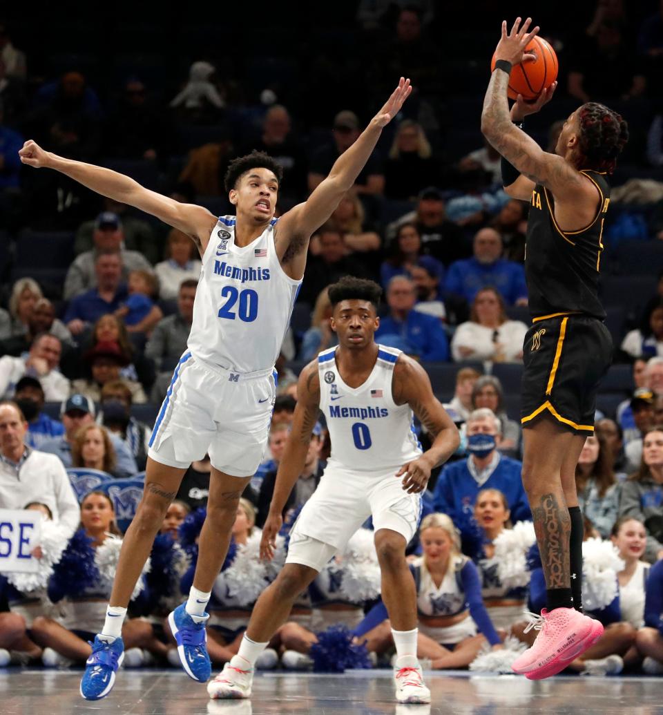 Memphis Tigers forward Josh Minott (20) guards Wichita State Shockers forward Monzy Jackson (5) during the second half of a game Sunday, Feb. 27, 2022, at FedExForum. The Memphis Tigers defeated the Wichita State Shockers 81-57. 