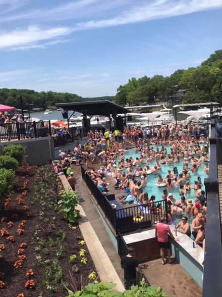 Hundreds attend a pool party at Backwater Jacks Bar & Grill at Osage Beach in Missouri.