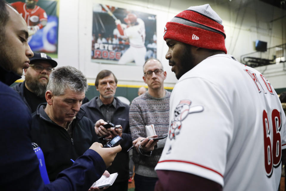 Cincinnati Reds Yasiel Puig speaks during a media availability at the P&G MLB Cincinnati Reds Youth Academy, Wednesday, Jan. 30, 2019, in Cincinnati. (AP Photo/John Minchillo)