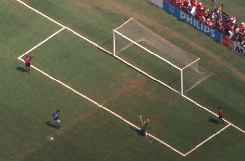 1994 WORLD CUP FINAL<br>17 JUN 1994:  ROBERTO BAGGIO (IN BLUE) MISSES THE DECISIVE PENALTY AS BRAZILIAN GOALKEEPER CLAUDIO TAFFAREL FALLS TO HIS KNEES AND RAISES HIS ARMS IN VICTORY AS BRAZIL WINS THE 1994 WORLD CUP FINAL.  BRAZIL WON DURING A PENALY SHOOT-OUT AT THE ROSE BOWL IN PASADENA, CALIFORNIA.
Mandatory Credit: Mike Powell/ALLSPORT
1994 WORLD CUP FINAL,ROBERTO,BAGGIO