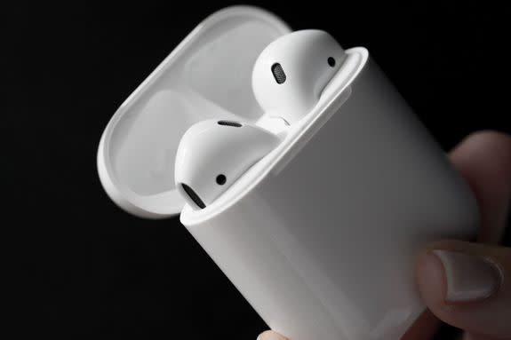 Apple AirPods in their carrying case.