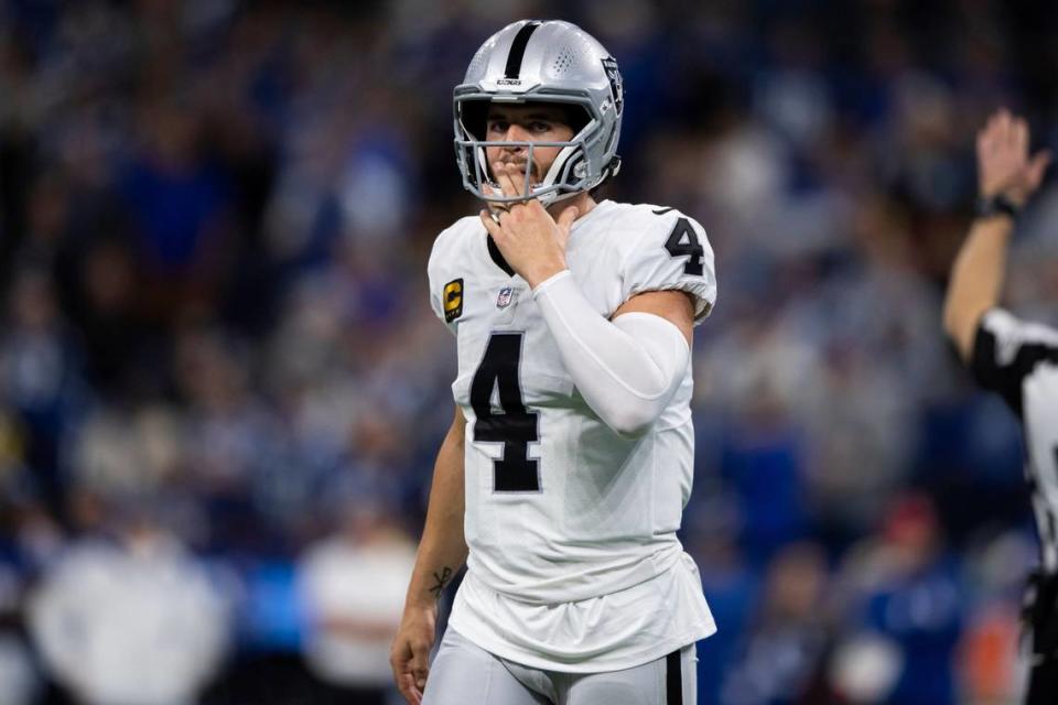 Las Vegas Raiders quarterback Derek Carr walk to the sidelines during an NFL football game against the Indianapolis Colts, Sunday, Jan. 2, 2022, in Indianapolis.