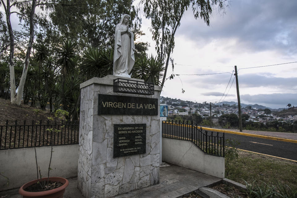 A 2013 plaque that reads in Spanish "Virgin of Life. In memory of unborn babies," placed by the Pro-Life Committee, stands outside the Basilica Our Lady of Suyapa in Tegucigalpa, Honduras, Monday, March 20, 2023. Honduras has one of the highest rates of teenage pregnancy in Latin America, more than double the world average, according to the U.N. Population Fund. (AP Photo/Ginnette Riquelme)