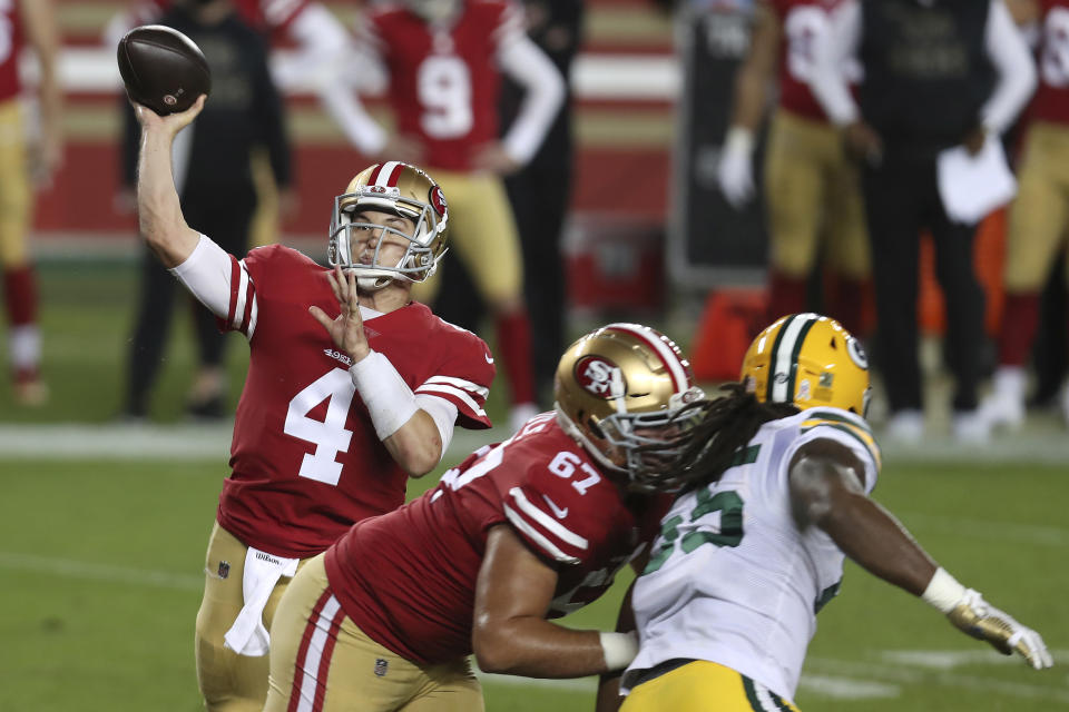 San Francisco 49ers quarterback Nick Mullens (4) passes against the Green Bay Packers during the first half of an NFL football game in Santa Clara, Calif., Thursday, Nov. 5, 2020. (AP Photo/Jed Jacobsohn)