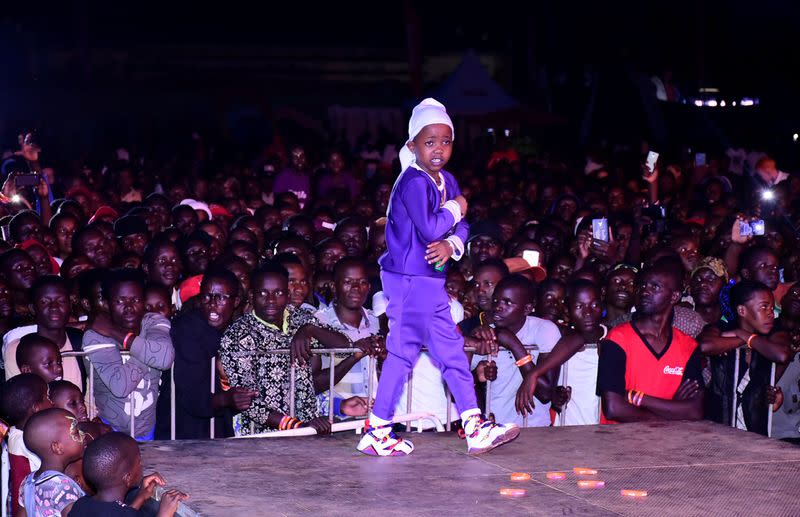 Ugandan eight-year-old rapper "Fresh Kid", whose real name is Patrick Ssenyonjo, performs during the "Purple Party" show in Jinja