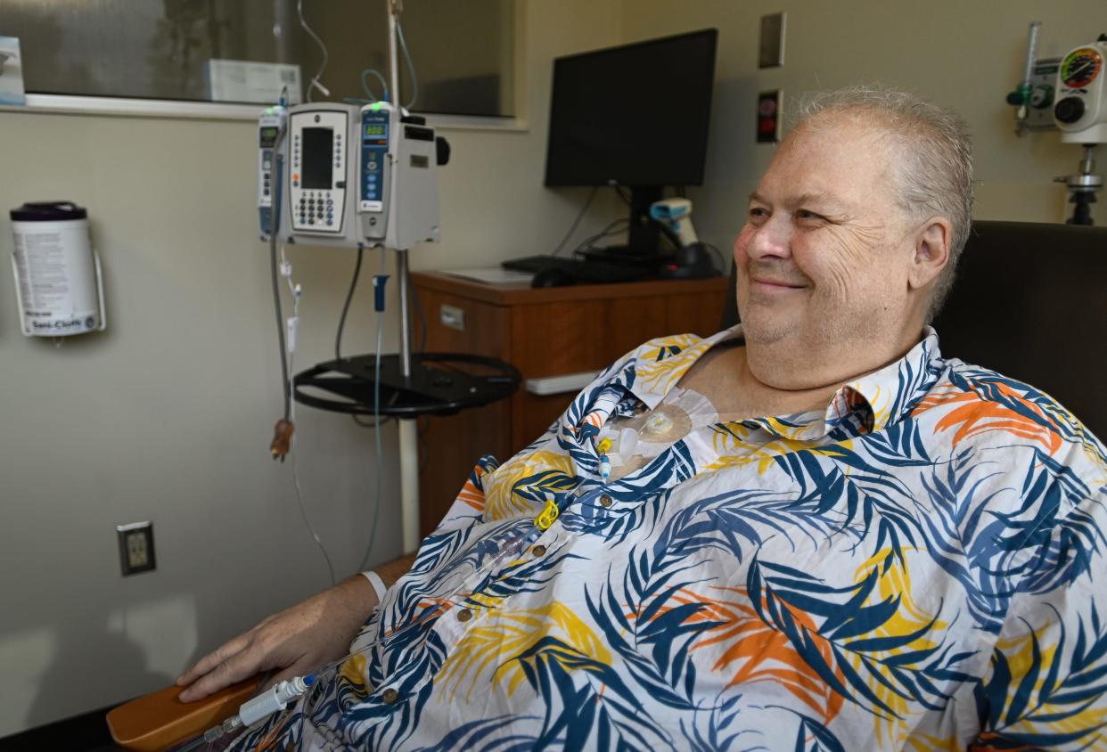 "I smile because I know people care and are rallying for me. It makes me want to fight this even more," Kevin Cronin, 61, of Holt says Wednesday, Oct. 18, 2023, during a chemotherapy infusion treatment at Sparrow's Herbert-Herman Cancer Center in Lansing.