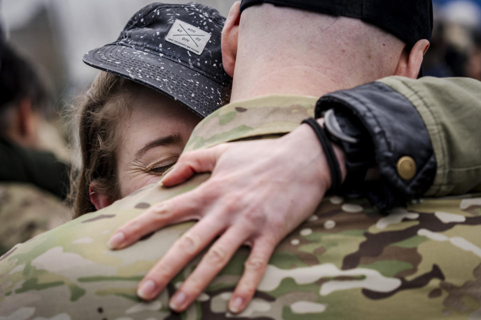 A woman hugs a crew member of the frigate Iver Huitfeldt upon its arrival at the base port at Fleet Station Korsoer, Denmark, Thursday, April 4, 2024. Since February 2024, the Danish frigate Iver Huitfeldt has been deployed in the Red Sea as part of the international coalition aimed following the attacks on commercial ships in the Red Sea by Yemen’s Iran-backed Houthi rebels. (Ida Marie Odgaard/Ritzau Scanpix via AP)