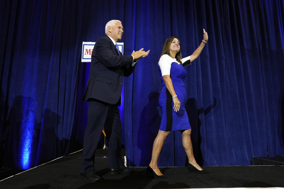 Republican presidential candidate former Vice President Mike Pence and his wife Karen arrives to speak at a campaign event, Wednesday, June 7, 2023, in Ankeny, Iowa. (AP Photo/Charlie Neibergall)