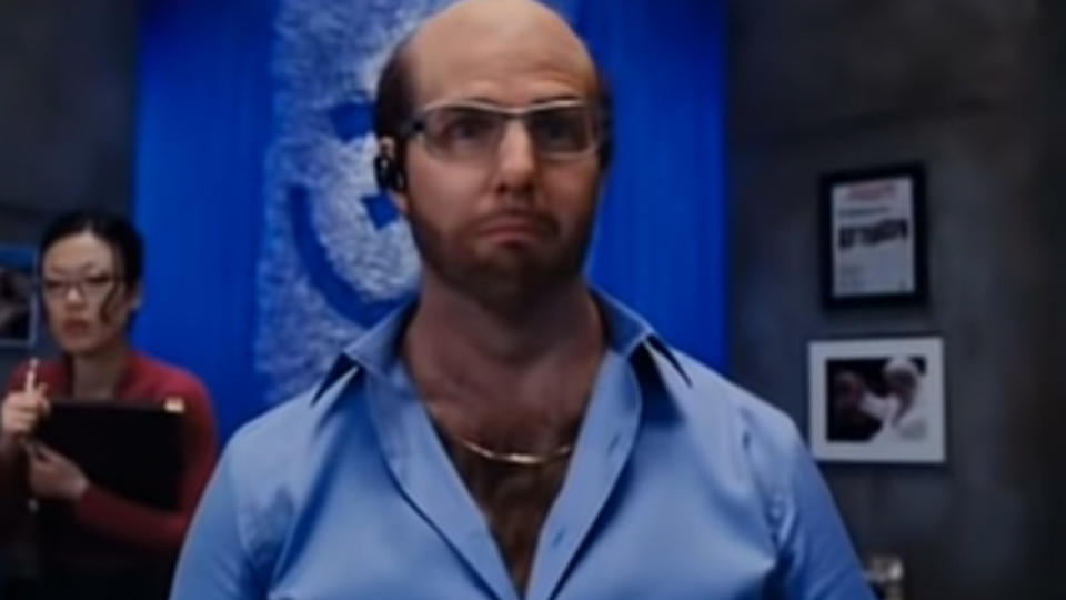 Tom Cruise with glasses and a beard and a bald head.