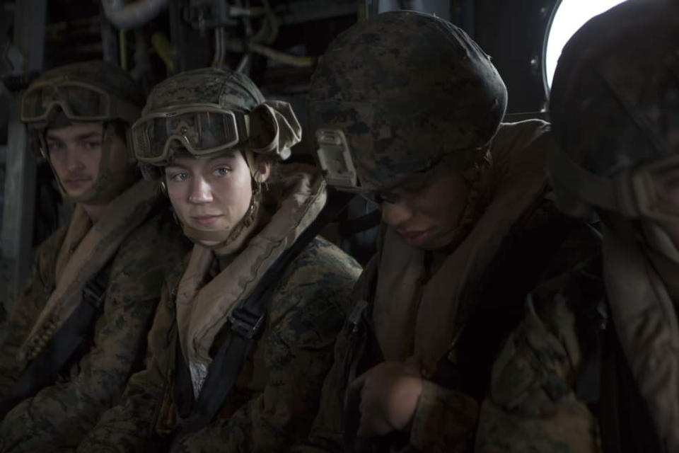 This Aug. 26, 2021, photo, released by U.S. Marine Corps/II Marine Expeditionary Force, shows U.S. Marine Corps Sgt. Nicole L. Gee, second from left, while supporting evacuation operations in Kabul, Kabul Province, Afghanistan. Sgt. Gee died following an attack near the Hamid Karzai International Airport in Kabul. Gee, 23, of Sacramento, California, was a maintenance technician with the 24th Marine Expeditionary Unit from Camp Lejeune in North Carolina. (U.S. Marine Corps/II Marine Expeditionary Force via AP)