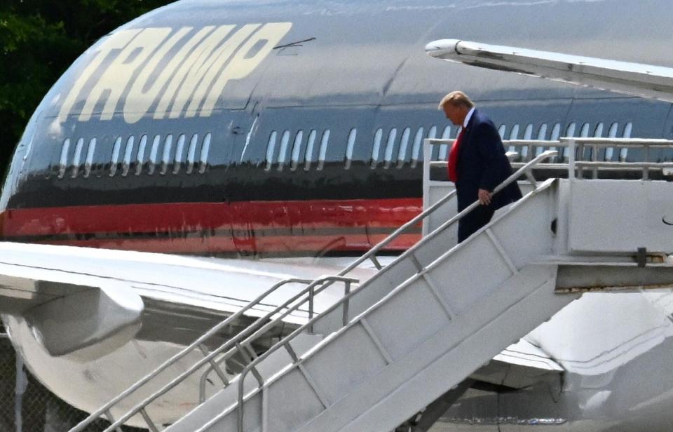 Former US President Donald Trump disembarks 