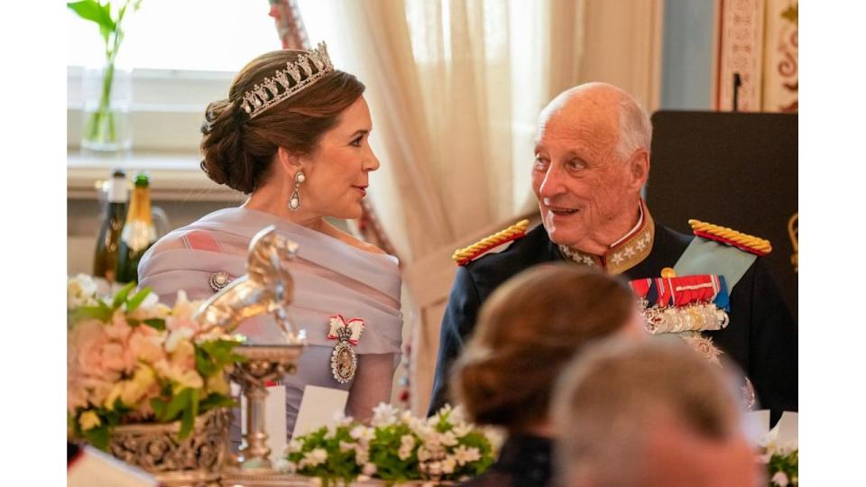 King Harald V of Norway (R) and Queen Mary of Denmark speak during a gala dinner