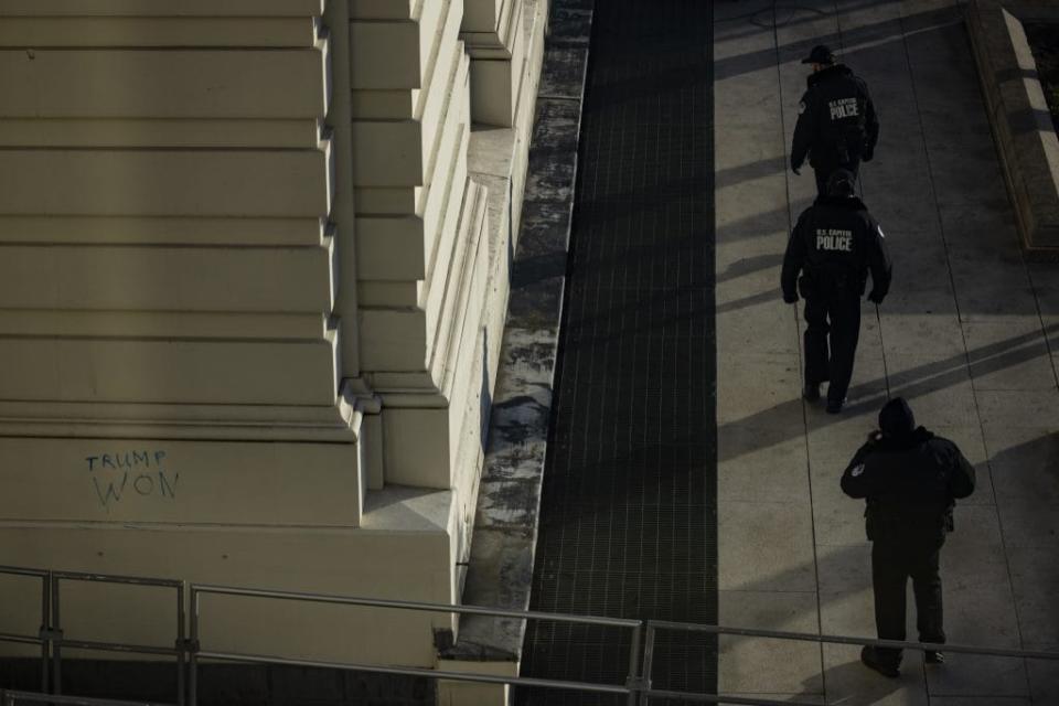 Capitol Police officers sweep the grounds of the U.S. Capitol building on January 7, 2021 in Washington, DC. Following a rally yesterday with President Donald Trump on the National Mall, a pro-Trump mob stormed and broke into the U.S. Capitol building causing a Joint Session of Congress to delay the certification of President-elect Joe Biden’s victory over President Trump. (Photo by Samuel Corum/Getty Images)