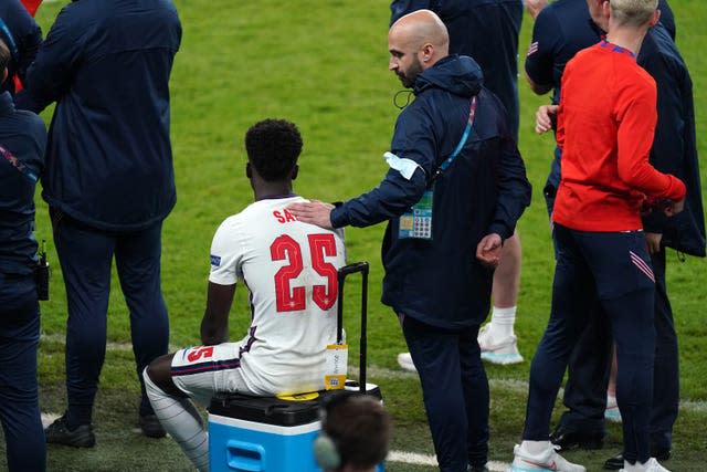 England’s Bukayo Saka sits dejected following defeat at Wembley 