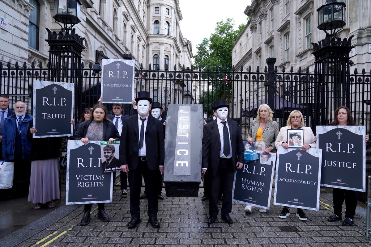 Representatives from Relatives for Justice, whose loved ones were murdered during the Troubles, protest in Parliament Square earlier this year (PA) (PA Wire)