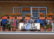 A banner reading "Go Bergamo", with the colors of the soccer team of the Northern Italian city hardest hit by coronavirus, is seen, in spite of fierce rivalry between the two cities, in Rome, Sunday, March 22, 2020. For most people, the new coronavirus causes only mild or moderate symptoms. For some it can cause more severe illness, especially in older adults and people with existing health problems. (Mauro Scrobogna/LaPresse via AP)