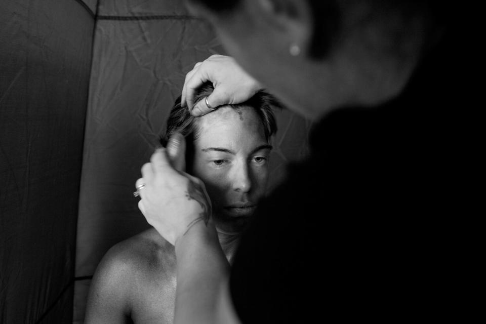 Fallon Turner gets her spray tan touched up in Metairie, La. As one of the few active female competitors, she was the only woman to compete in this show.