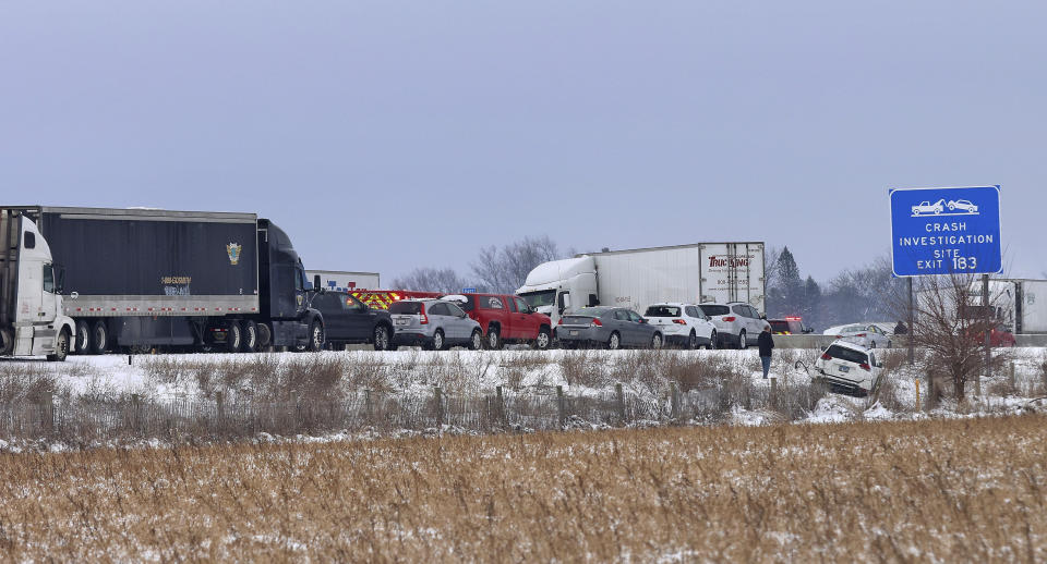 Emergency crews respond to a multi-vehicle accident in both the north and south lanes of Interstate 39/90 on Friday, Jan. 27, 2023 in Turtle, Wis. Authorities say snowy conditions led to a massive traffic pile-up in southern Wisconsin on Friday that left Interstate 39/90 blocked for hours. (Anthony Wahl/The Janesville Gazette via AP)