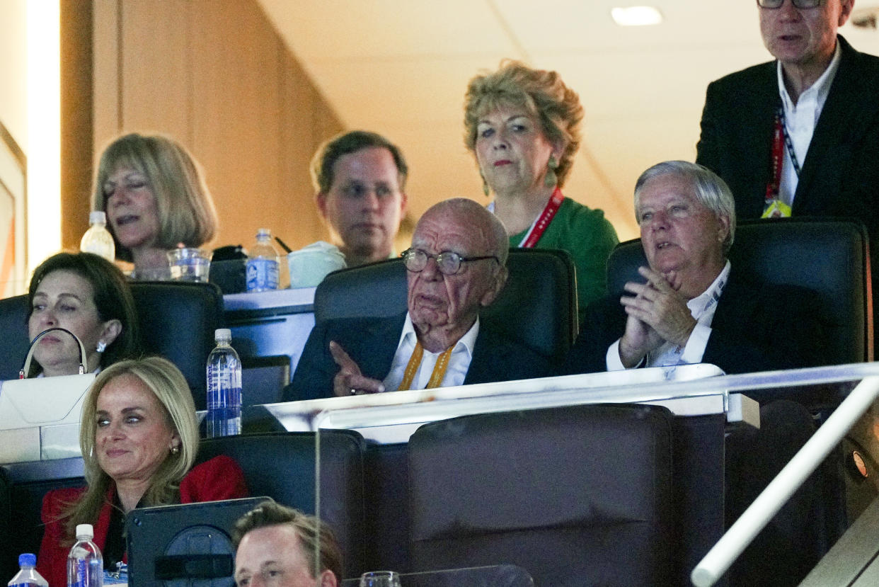 Australian American businessman Rupert Murdoch, center, near Sen. Lindsay Graham (R-S.C), right, on the third day of the Republican National Convention at Fiserv Forum in Milwaukee, on July 17, 2024. (Jamie Kelter Davis/The New York Times)