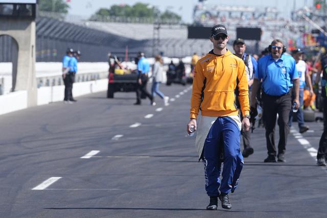 Alexander Rossi walks down pit lane before the final practice for the Indianapolis 500 auto race at Indianapolis Motor Speedway, Friday, May 26, 2023, in Indianapolis. (AP Photo/Darron Cummings)
