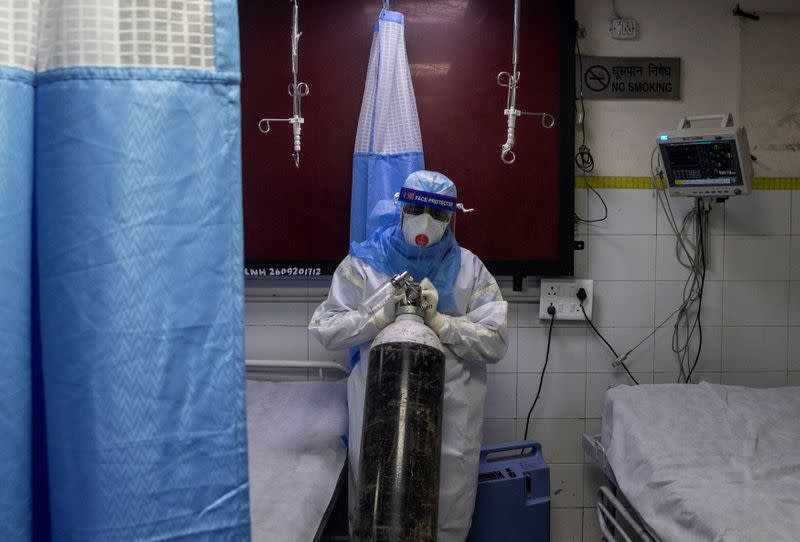 Medical workers treat patients infected with the coronavirus disease (COVID-19) at a hospital in New Delhi