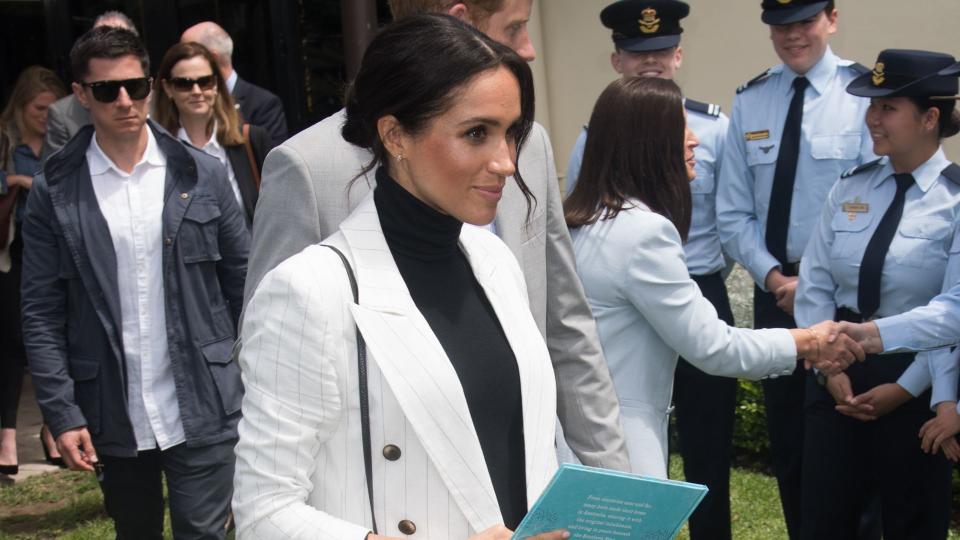 Meghan in a blazer with jeans