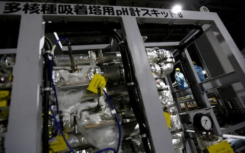 Tepco employees are seen inside the tsunami-crippled plant - Credit: &nbsp;Issei Kato/&nbsp;REUTERS