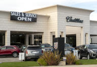 THOUSAND OAKS, CA - MAY 06: A Cadillac Dealership displays a sign stating its reopened during the Coronavirus Pandemic on May 06, 2020 in Thousand Oaks, California. The coronavirus pandemic worldwide has claimed over 263,000 lives and infected over 3.7 million people. (Photo by Josh Lefkowitz/Getty Images)