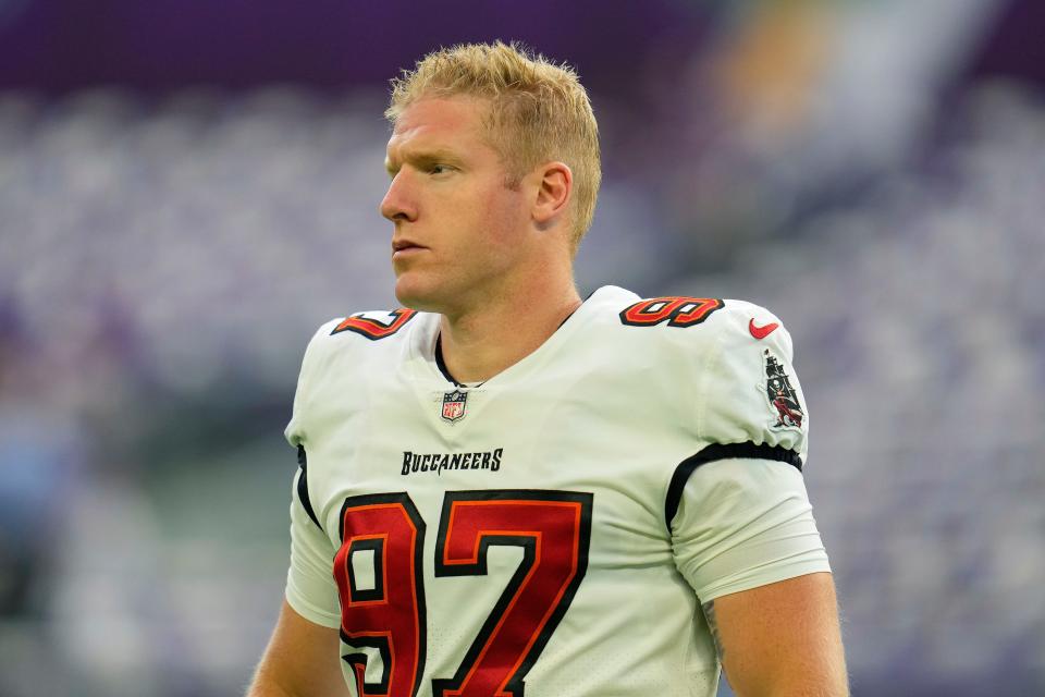 Tampa Bay Buccaneers long snapper Zach Triner stands on the field before a football game against the Minnesota Vikings.