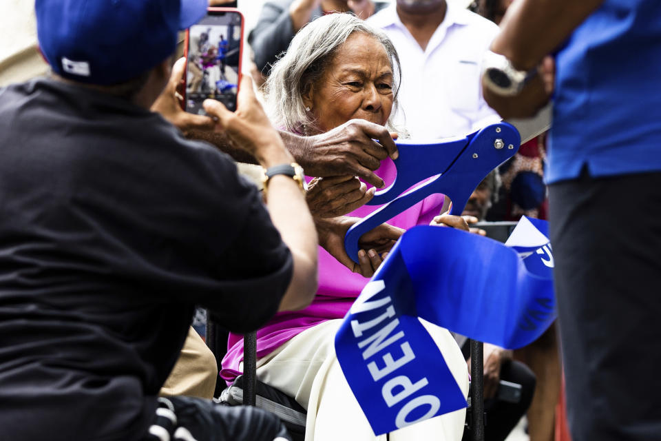 CORRECTS MONTH TO JULY, NOT JUNE - Rachel Robinson, widow of Jackie Robinson, cuts the ribbon for the opening of the Jackie Robinson Museum, Tuesday, July 26, 2022, in New York. (AP Photo/Julia Nikhinson)