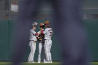 Arizona Diamondbacks outfielders Corbin Carroll, from left, Daulton Varsho and Jake McCarthy celebrate after the team's 8-4 victory over the San Francisco Giants in a baseball game in San Francisco, Saturday, Oct. 1, 2022. (AP Photo/Godofredo A. Vásquez)