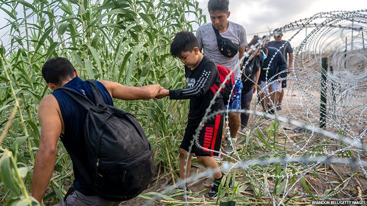 Migrants making a dangerous cross of the Rio Grande into Texas.