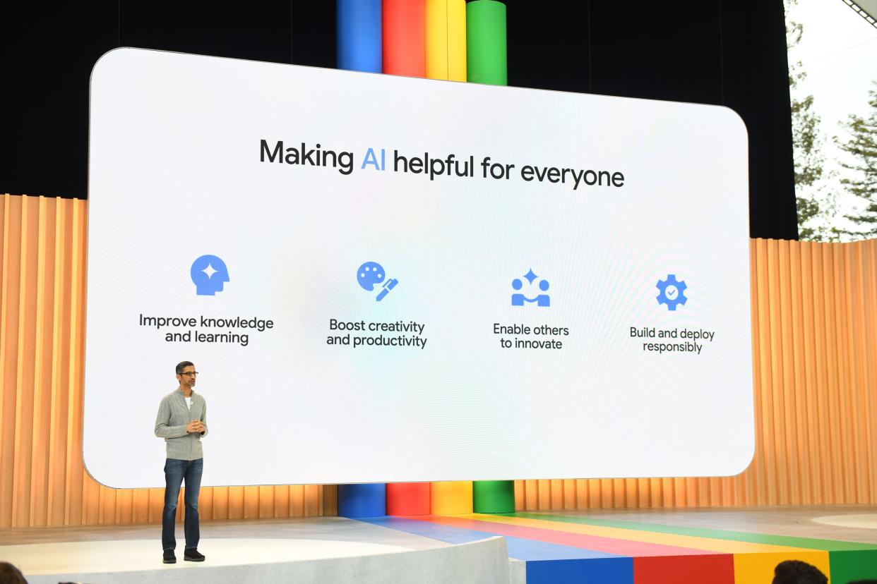 Sundar Pichai onstage in front of a presentation titled "Making AI helpful for everyone."