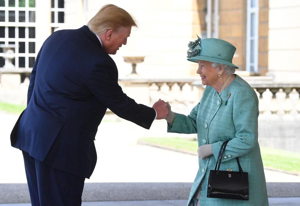 Britain's Queen Elizabeth II shakes hands with US President Donald Trump