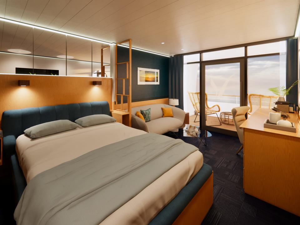 A rendering of a stateroom on a cruise ship with a bed, desk, couch, and balcony.
