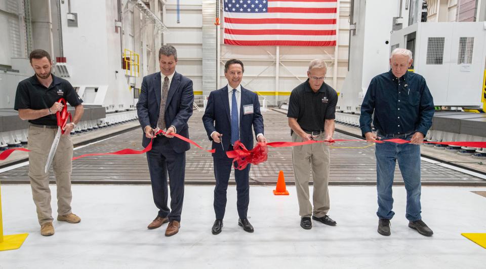 Narek Gasparyan (from left), Chip Storie, Lodovico Camozzi, Dave Zarembaski and Roger Beck cut the ribbon at Ingersoll Machine Tolls on Thursday, July 21, 2022, in Rockford.