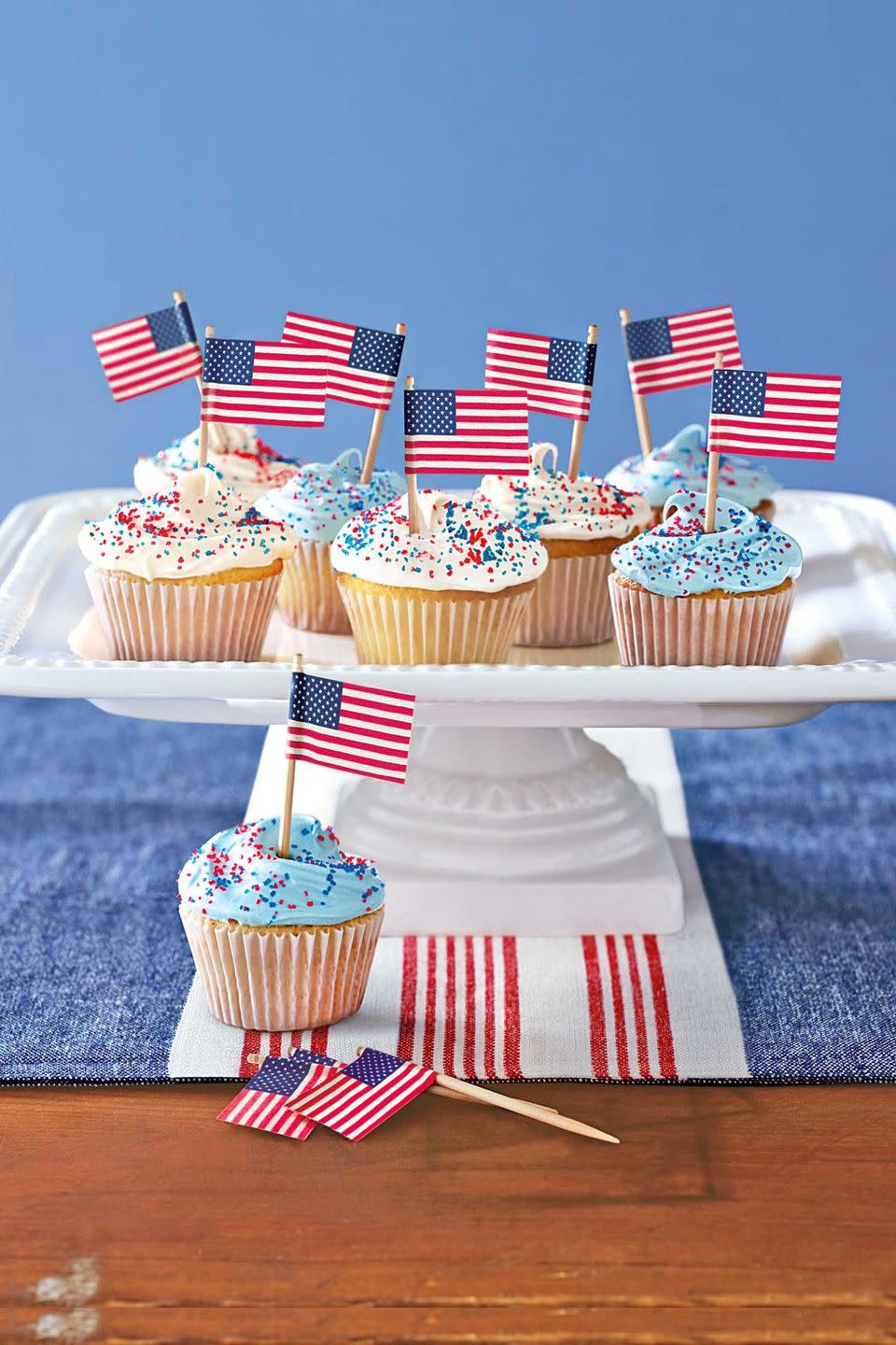 <p>Red and blue sprinkles — plus mini American flags — add the perfect all-star touch to these classic <a href="https://www.goodhousekeeping.com/food-recipes/a28565483/vanilla-cupcakes-recipe/" rel="nofollow noopener" target="_blank" data-ylk="slk:vanilla cupcakes;elm:context_link;itc:0;sec:content-canvas" class="link ">vanilla cupcakes</a>.</p><p><em><a href="https://www.countryliving.com/food-drinks/recipes/a28340/patriotic-cupcakes-121077/" rel="nofollow noopener" target="_blank" data-ylk="slk:Get the recipe from Country Living »;elm:context_link;itc:0;sec:content-canvas" class="link ">Get the recipe from Country Living »</a></em> </p>