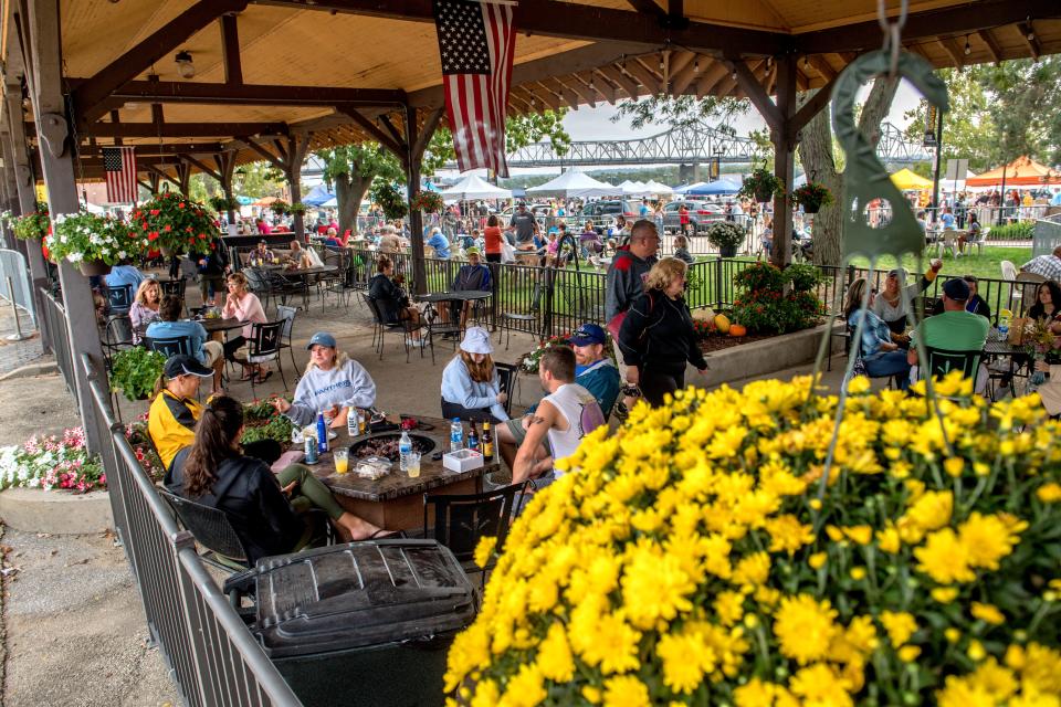 Customers relax in the beer garden Saturday, Sept. 26, 2020, on the last day of the season for the Peoria Riverfront Market.
