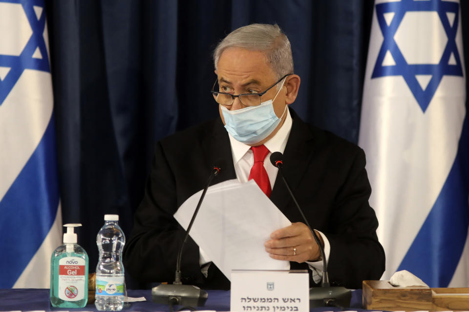 Israeli Prime Minister Benjamin Netanyahu, wearing a protective mask due to the COVID-19 pandemic, chairs the weekly cabinet meeting in Jerusalem, Sunday, June 7, 2020. (Menahem Kahana/Pool Photo via AP)