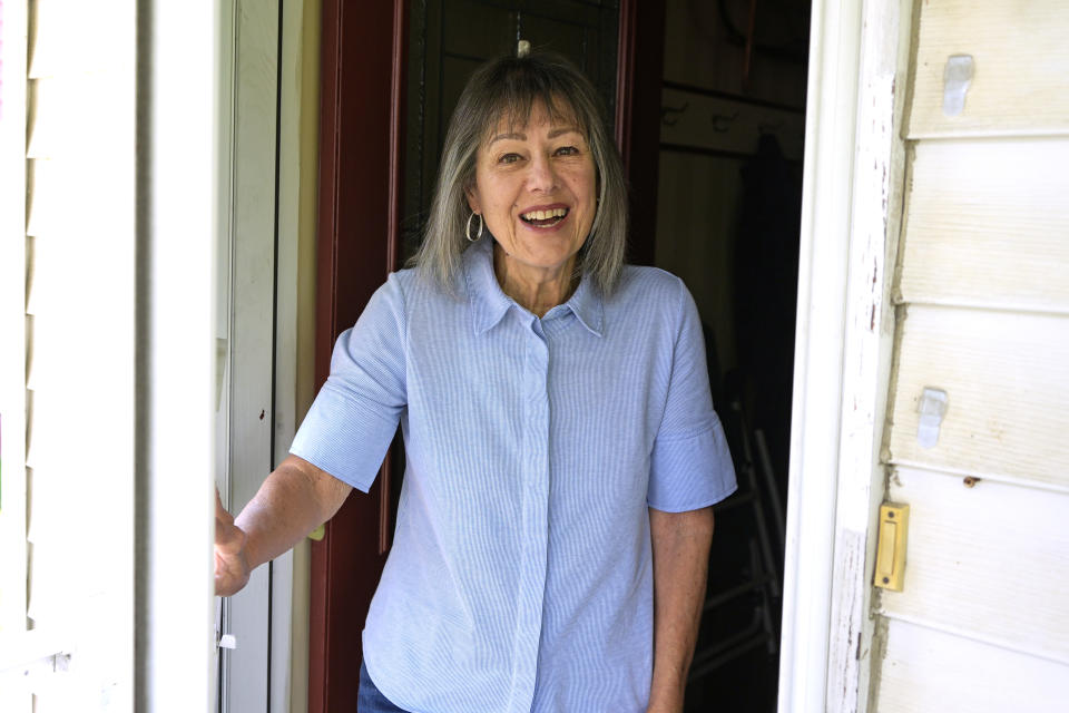 Susan Pryce answers the door at her Derry, Pa., home, Saturday, May 11, 2024. A Democratic group is rolling out a new $140 million ad campaign this week that aims to chip away at Donald Trump’s support among one of his most loyal voting blocs: rural voters. Pryce, 74, a retired nurse, has offered a litany of reasons why she does not support Trump, from his comments maligning the late Sen. John McCain, a former prisoner of war, to his history of bragging about sexually abusing women.(AP Photo/Gene J. Puskar)