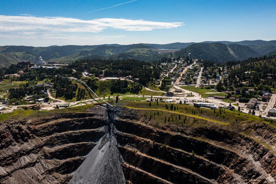 An open cavern at the Sanford Underground Research Facility with hills in the background