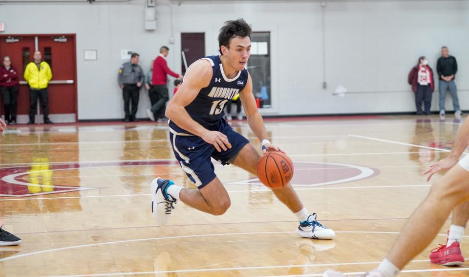Monmouth guard Jack Collins drives against Colgate on Nov. 21, 2022 in Hamilton, New York.