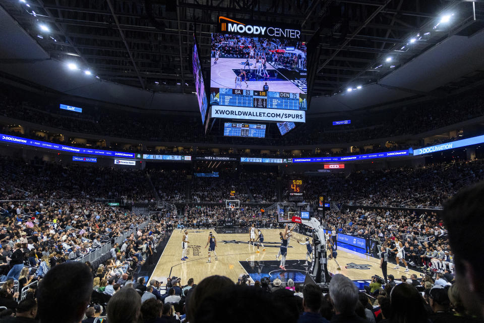Basketball fans watch as the Denver Nuggets compete against the San Antonio Spurs during the second half of an NBA basketball game, Friday, March 15, 2024, in Austin, Texas. (AP Photo/Stephen Spillman)