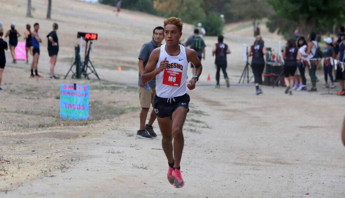 Evert Silva of Fresno gets past the 2-mile mark at the Miguel Reyes 5K at Woodward Park on July 31, 2022.