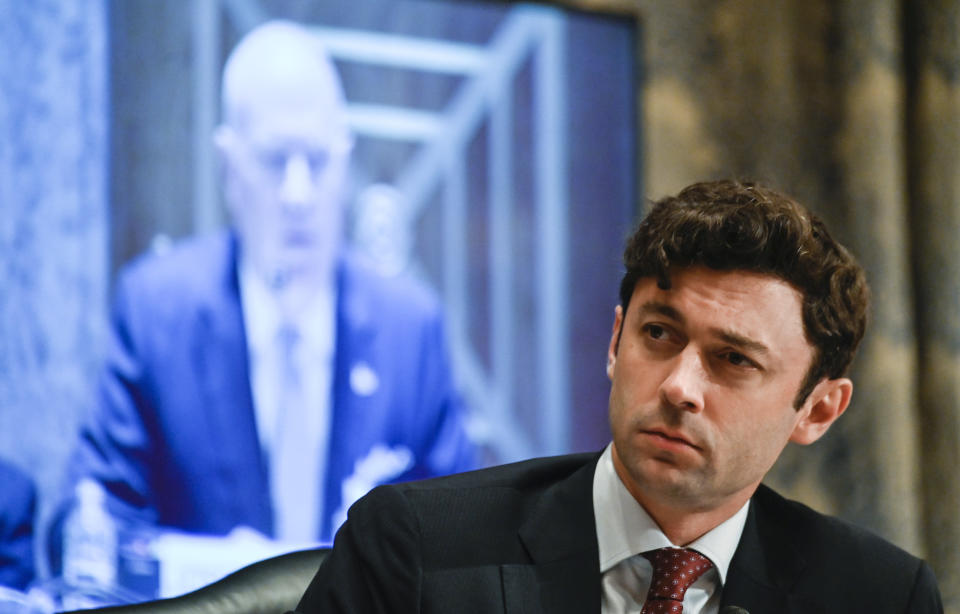 Sen. Jon Ossoff, D-Ga., listens as Colonial Pipeline CEO Joseph Blount testifies during a Senate Homeland Security and Government Affairs Committee hearing one day after the Justice Department revealed it had recovered the majority of the $4.4 million ransom payment the company made in hopes of getting its system back online, Tuesday, June 8, 2021, on Capitol Hill, in Washington. (Andrew Caballero-Reynolds/Pool via AP)