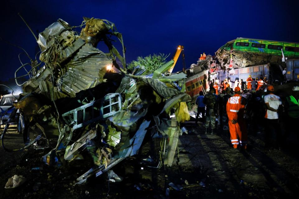 Rescue workers examine the scenes in Odisha (REUTERS)