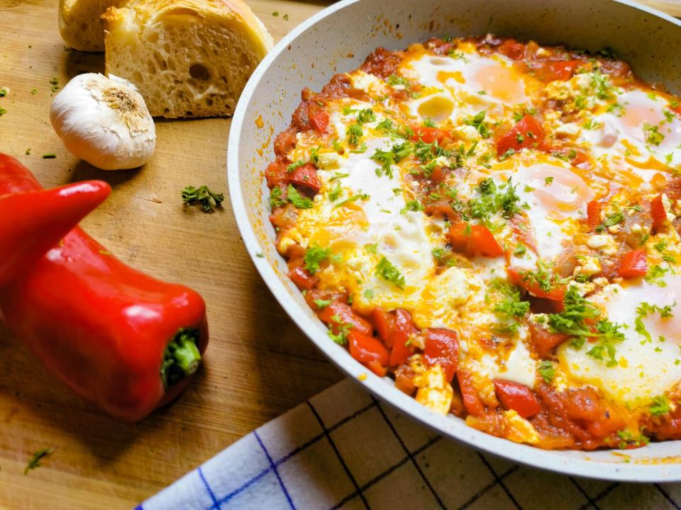 shakshuka with bread and cheese and eggs