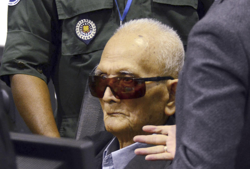 In this photo released by the Extraordinary Chambers in the Courts of Cambodia, Nuon Chea, who was the Khmer Rouge's chief ideologist and No. 2 leader, sits in a court room before a hearing at the U.N.-backed war crimes tribunal in Phnom Penh, Cambodia, Friday, Nov. 16, 2018. The international tribunal to judge the criminal responsibility of former Khmer Rouge leaders for the deaths of an estimated 1.7 million Cambodians opened its session Friday to deliver its verdicts on charges of genocide and other crimes. (Nhet Sok Heng/Extraordinary Chambers in the Courts of Cambodia via AP)