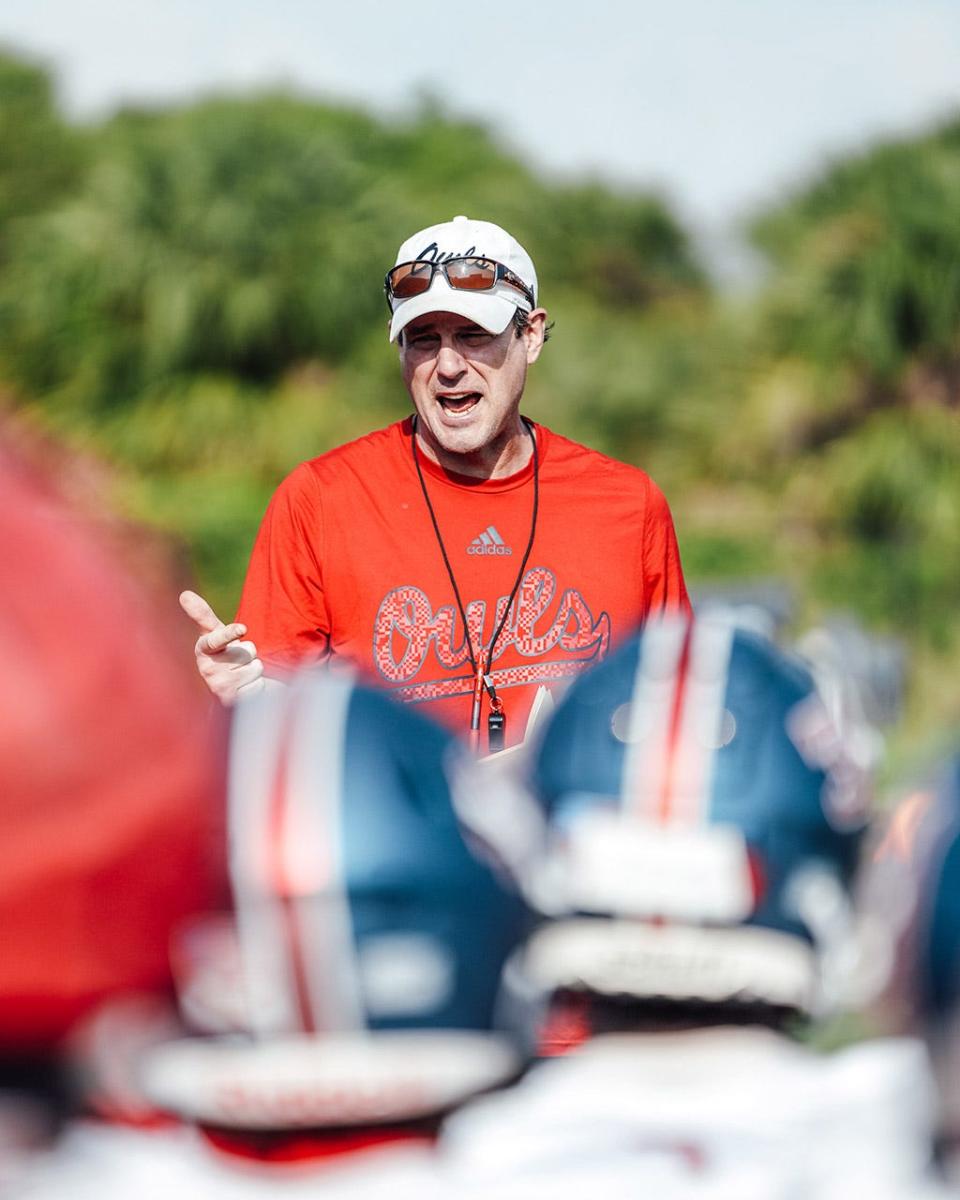 First-year FAU football coach Tom Herman talks to the team on the first day of spring practice.